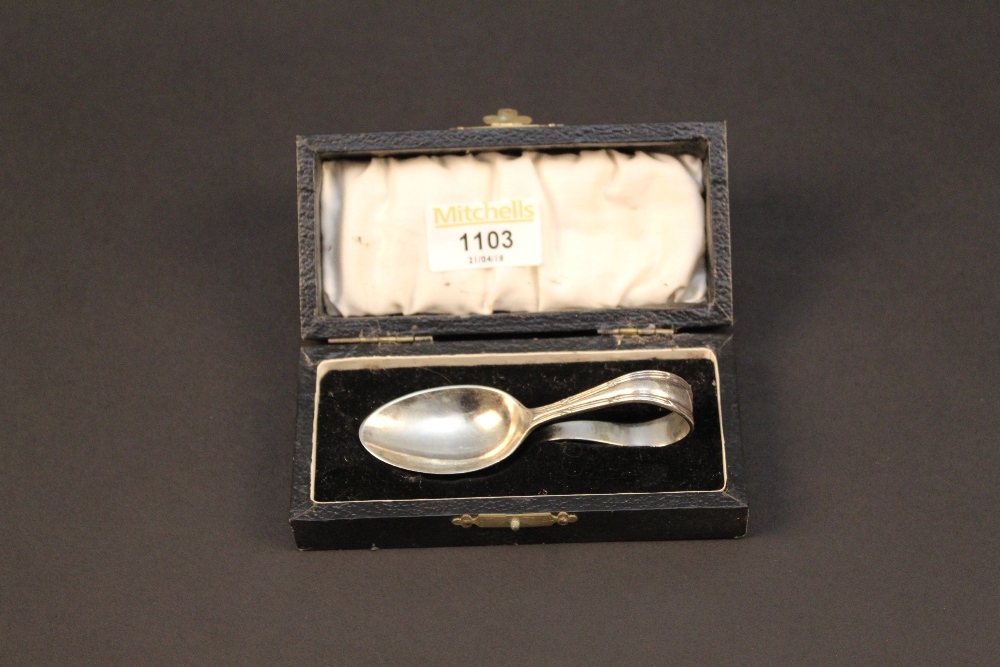 A 1930's silver feeding spoon, cased, Sh