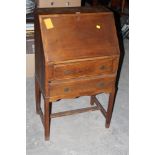 A 1930's oak fall front bureau, with two