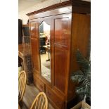 An Edwardian inlaid mahogany three piece