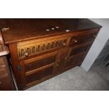 A reproduction oak sideboard, in the man