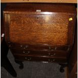 A small oak fall front bureau with three