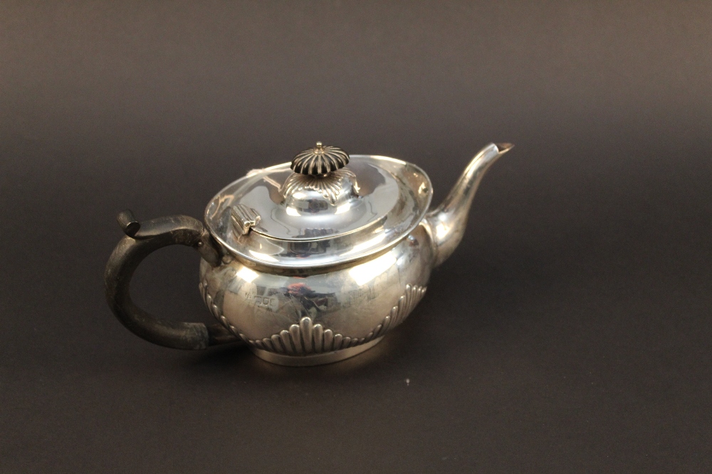 A late Victorian silver teapot, oval for