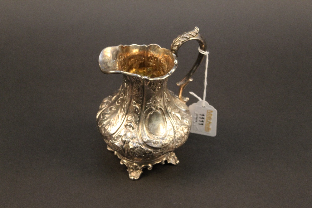 A Victorian embossed silver milk jug, wa