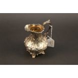 A Victorian embossed silver milk jug, wa