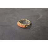 A 9 ct gold and coral five stone ring, m