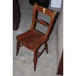 A 19th century elm seated kitchen chair,