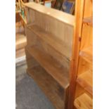 A reclaimed pine waterfall bookcase with