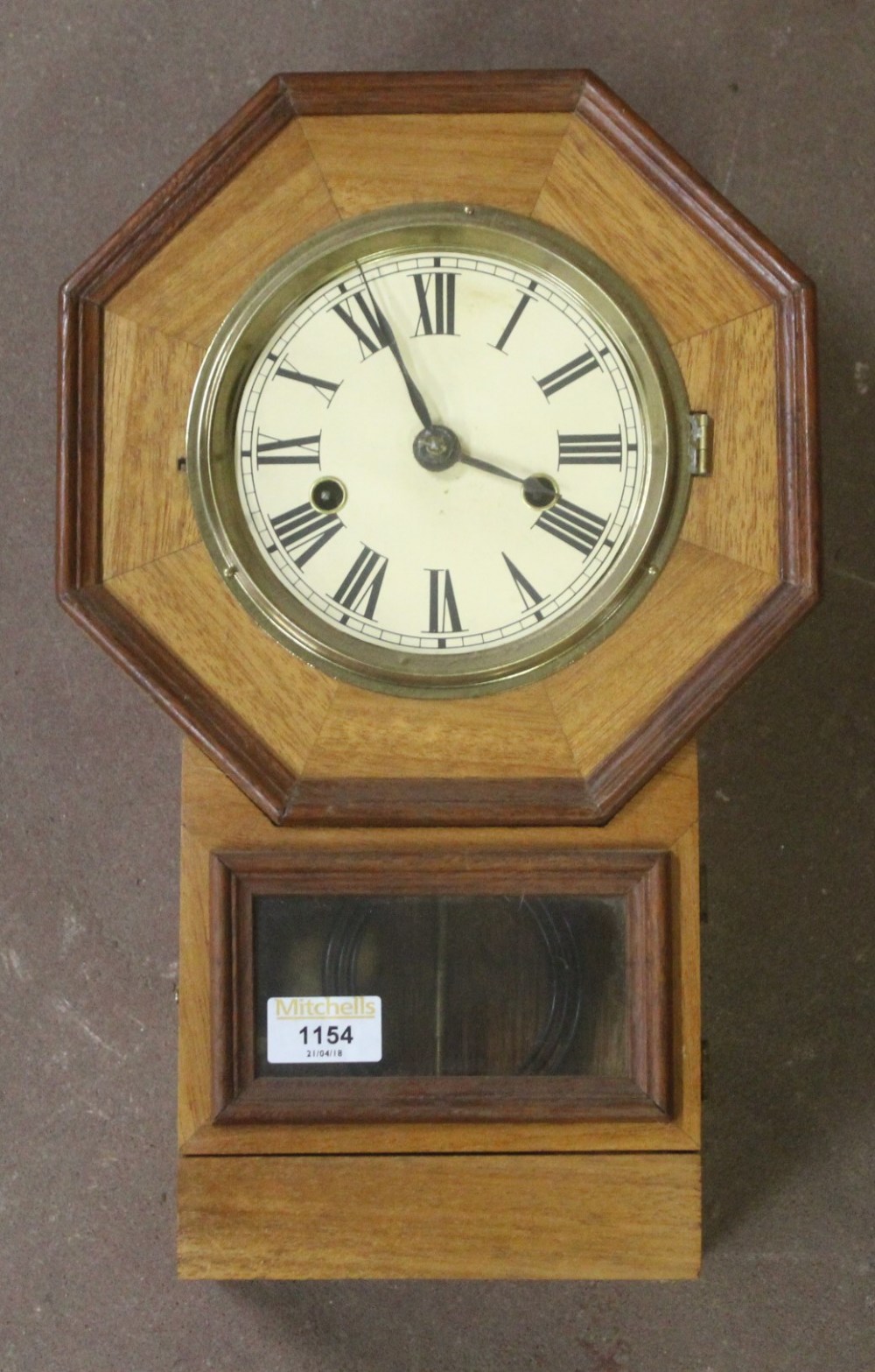 A small mid-century mahogany drop dial w