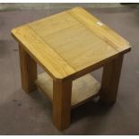 A small modern oak coffee table, with un