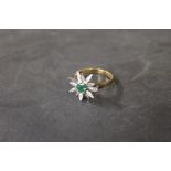 An 18 ct gold emerald and diamond flower