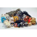 A collection of plush toys including Battery Furbies and others.