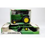 Ertl 1/16 John Deere row crop tractor and disc Harrow. Generally excellent in original box.