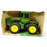 Ertl 1/16 John Deere four-wheel drive tractor. Generally excellent in original box.