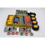 A large quantity of Meccano components, tools, parts and accessories. Various colour combinations in