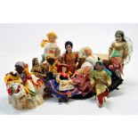 Group of small dolls originating from various countries, cultures including Asian, African and