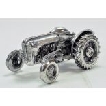 Unknown maker of a 1/16 Massey Ferguson 35 Tractor finished in chrome. Generally Excellent.