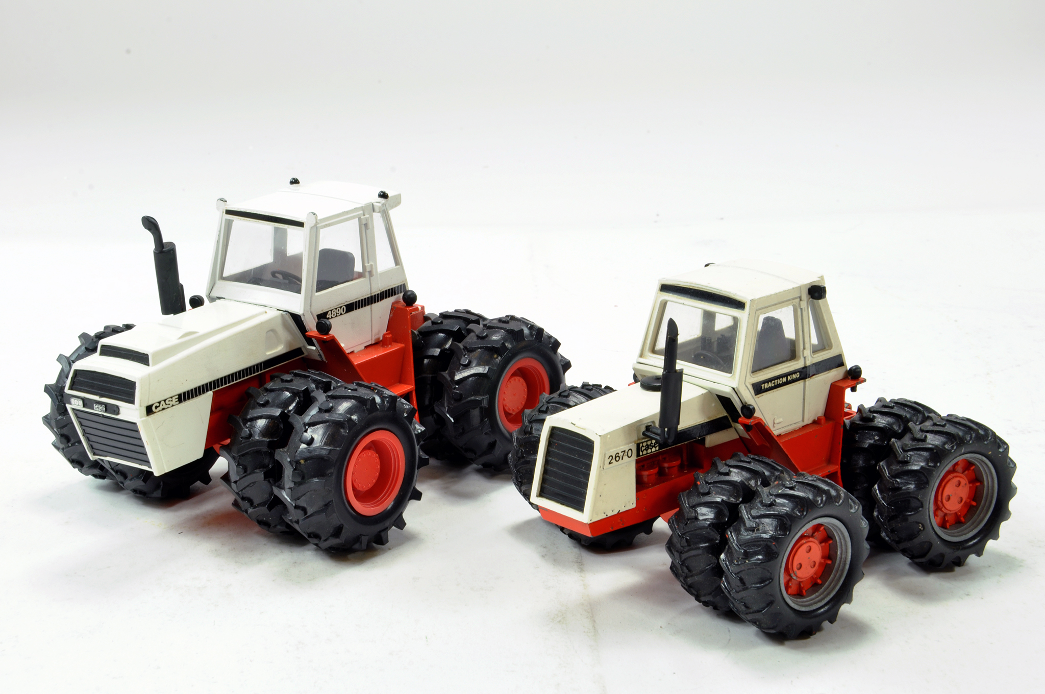 NZG and Conrad 1/35 Tractor duo comprising CASE 2670 and 4890 4WD models. Generally G to VG.