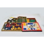 A large quantity of Meccano components, tools, parts and accessories. Various colour combinations in