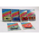 Tins Toys carded diecast car group. Various issues. Generally Excellent.