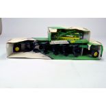 Ertl 1/16 John Deere implement duo comprising plough and hay rake. Generally excellent in original