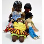 Group of fabric based dolls and two others originating from Asian, African American, Eskimo themes.