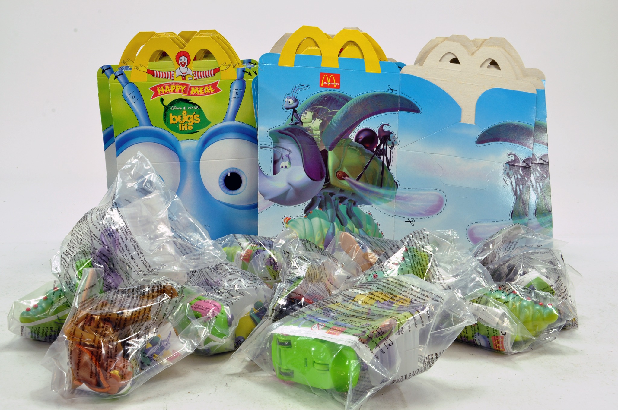 Macdonalds Happy Meal Toy Group comprising items from Bugs Life Series including Toys and Unfolded