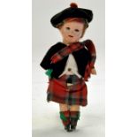 Antique Doll. Early German marked Bisque Head Doll in wonderful Scottish Outfit. Missing one hand,