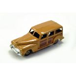 Dinky No. 27f - 344 Plymouth Estate Car with tan body, dark brown side panels, silver trim, fawn