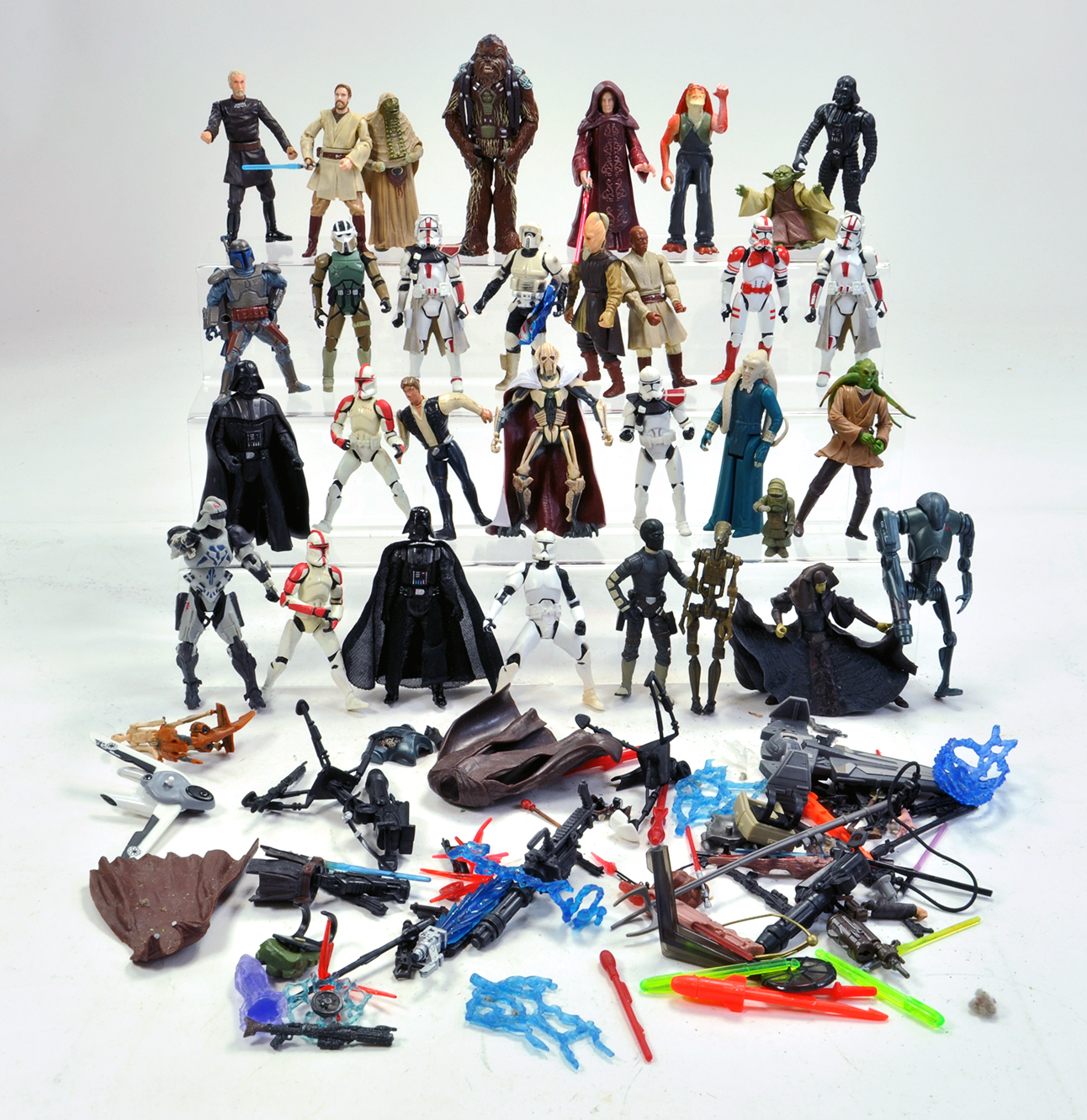 A quantity of Star Wars Figures plus weapons etc. Most played with it but generally good.