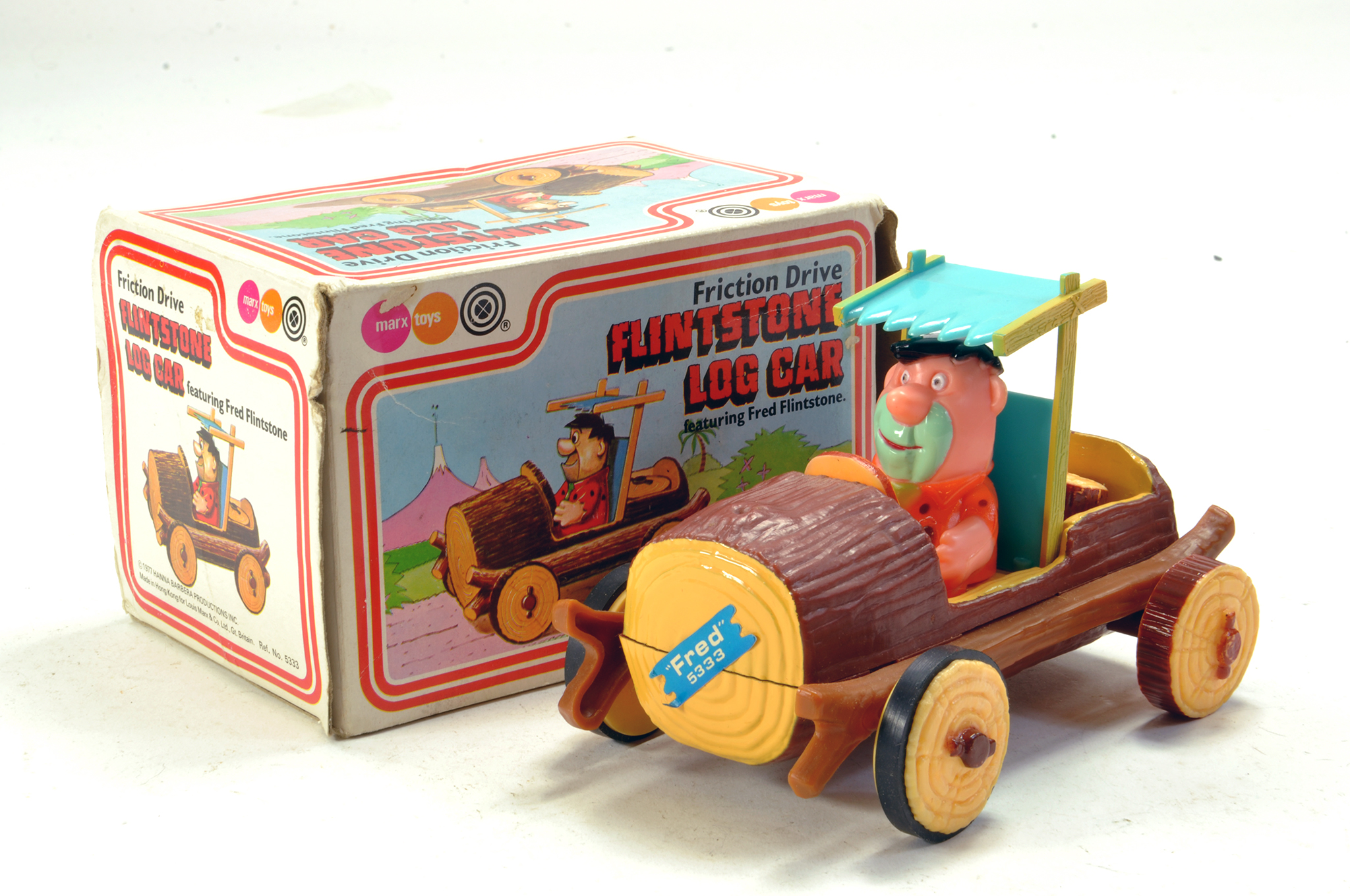 Marx Toys Friction Driven Log Car as seen in the Flinstones, with Fred as driver. Rare Toy is