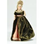 Antique Doll, early Bisque head and arm doll with refined facial features. 12". Beautifully dressed.