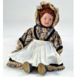 Antique Doll. Bisque head, cloth body, dressed exquisitely. 10/11".