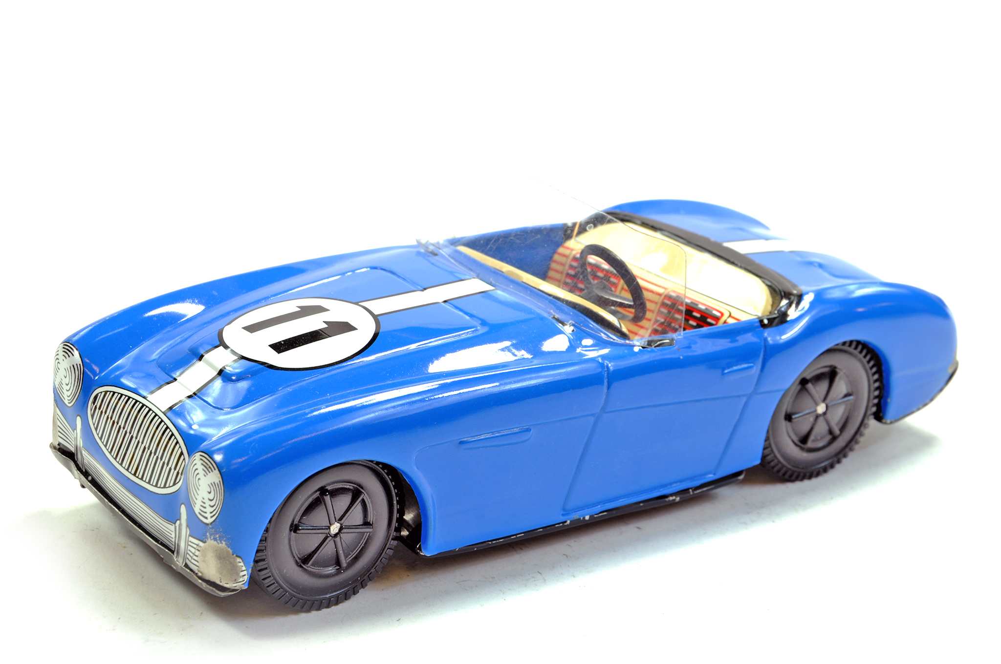 Joustra France Tinplate Austin Healey, friction driven, in blue, racing 11. Generally very good.