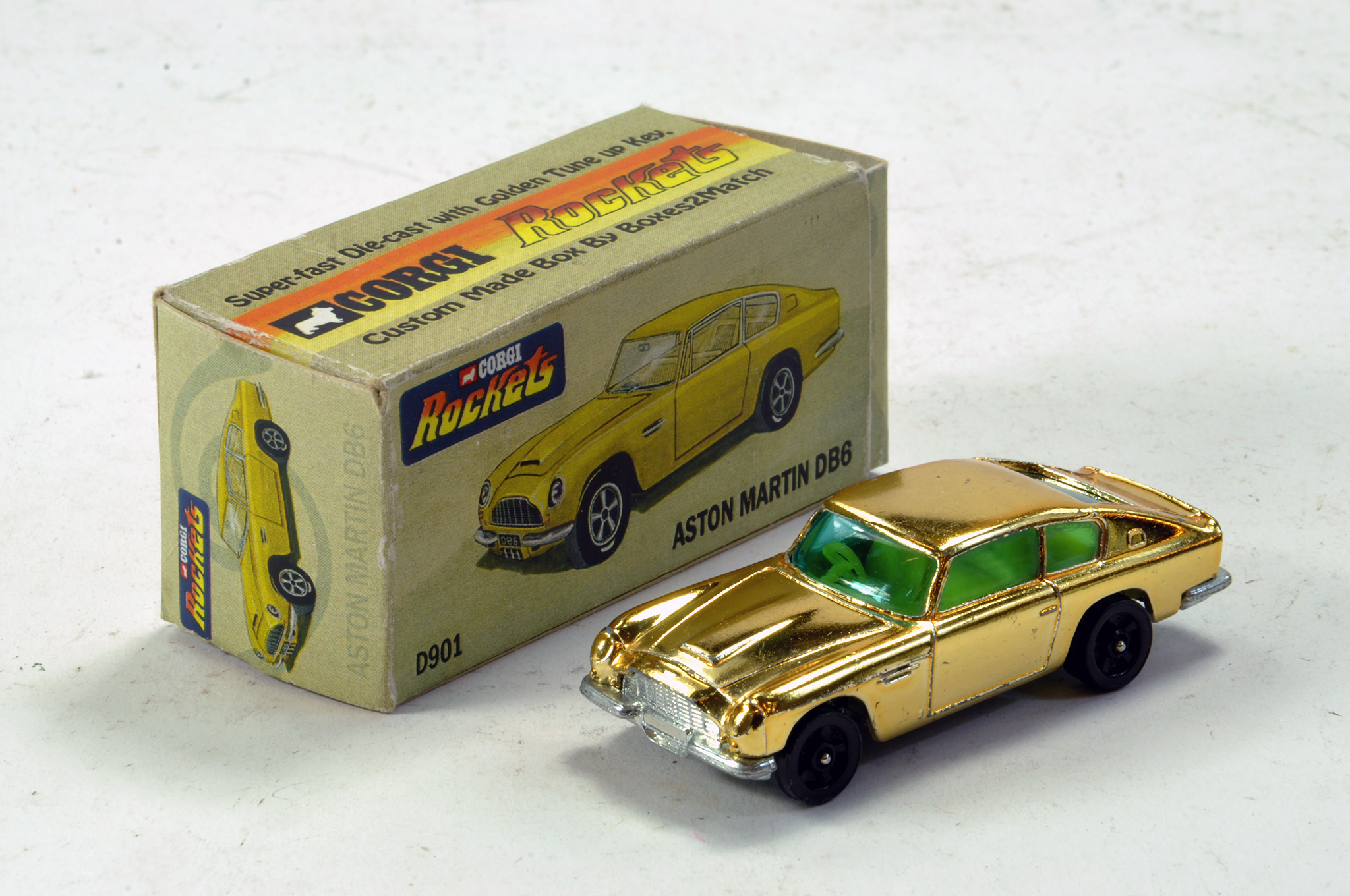 Corgi Rockets No. D901 Gold Plated Aston Martin DB6 With bespoke Box. A nice example in very good