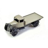 Dinky No. 25c Flat Truck with fawn body, black chassis and black ridged hubs. Nice example appears
