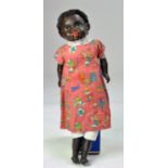 Antique Doll, a further well preserved composition, glass eyes black part mechanical squeak doll.