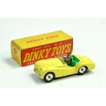 Dinky No. 105 Triumph TR2 Sports Car with pale yellow (lemon) body, pale green interior and chrome