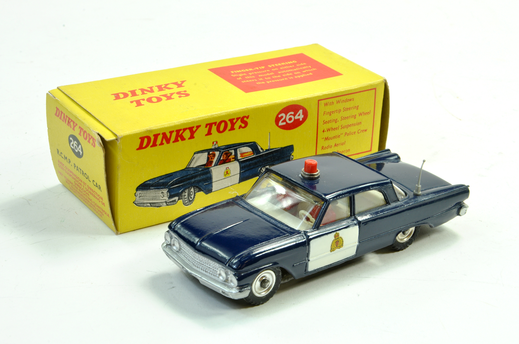 Dinky No. 264 Ford Fairlane RCMP Patrol Car in dark blue with white doors and chrome spun hubs.