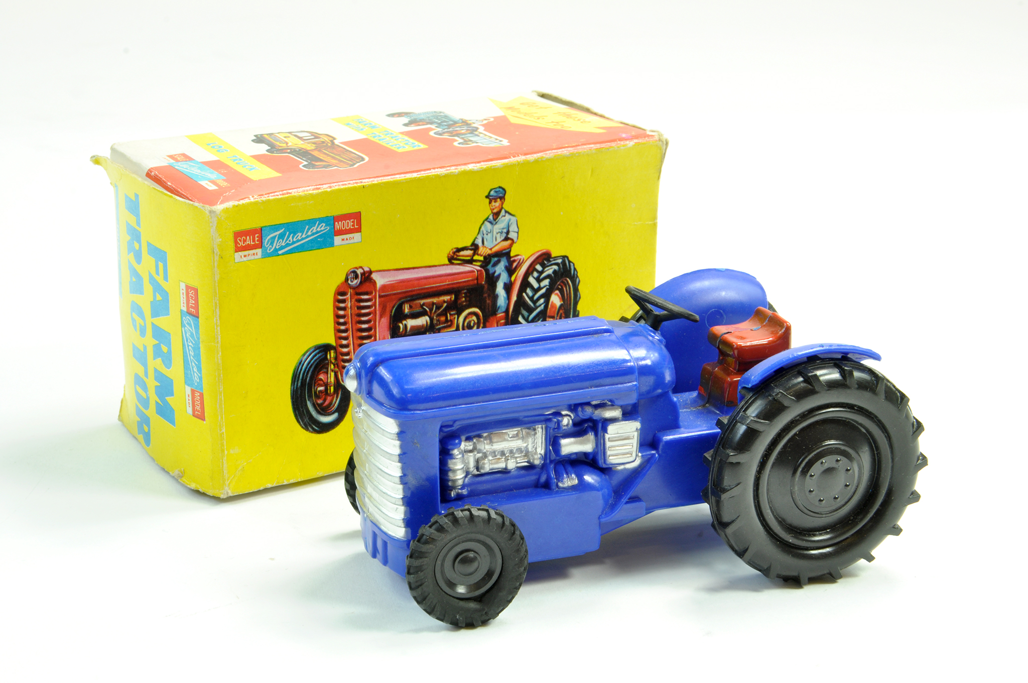 Telsalda (Hong Kong) friction driven plastic Farm Tractor in blue. Generally very good to