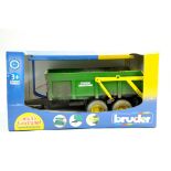 Bruder 1/16 John Deere themed trailer. Weathered. Excellent in Box.