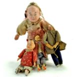 Group of interesting and vintage wooden / compositional asian dolls, one of missionary type.