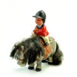 Rare Thelwell model pony and rider made by Plastech. Rider sports a red show jacket, riding hat,