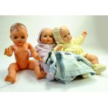 Group of large plastic baby dolls with clothing. Generally very good. Note: We are happy to