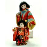 Duo of Chinese / Asian Bisque Dolls. In bright vibrant dress. Condition is generally good to very