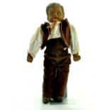 An extremely unusual antique doll comprising a 'Clay' Compositional very heavy headed boy figure