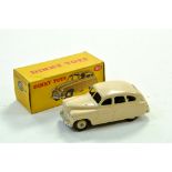 Dinky No. 153 Standard Vanguard Saloon with cream body and ridged hubs. Generally Good in Good