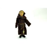 An interesting, likely antique 8” Friar/Monk Doll. No markings, bisque head cloth arms and legs