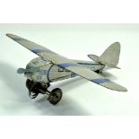 A 1933 Mettoy Mechanical Single Engine Tinplate Monoplane, silver with blue trim. Replacement