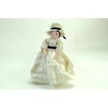 An interesting wooden peg doll, brightly presented with costume. Very Good. Note: We are happy to