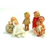 An interesting group of vintage doll issues. Including Kewpie examples and other miniature